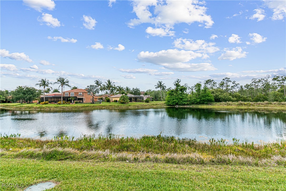 9138 Water Tupelo Road Fort Myers, FL 33912 - Photo 4 of 28 a view of a lake in a residential house with outdoor space and lake