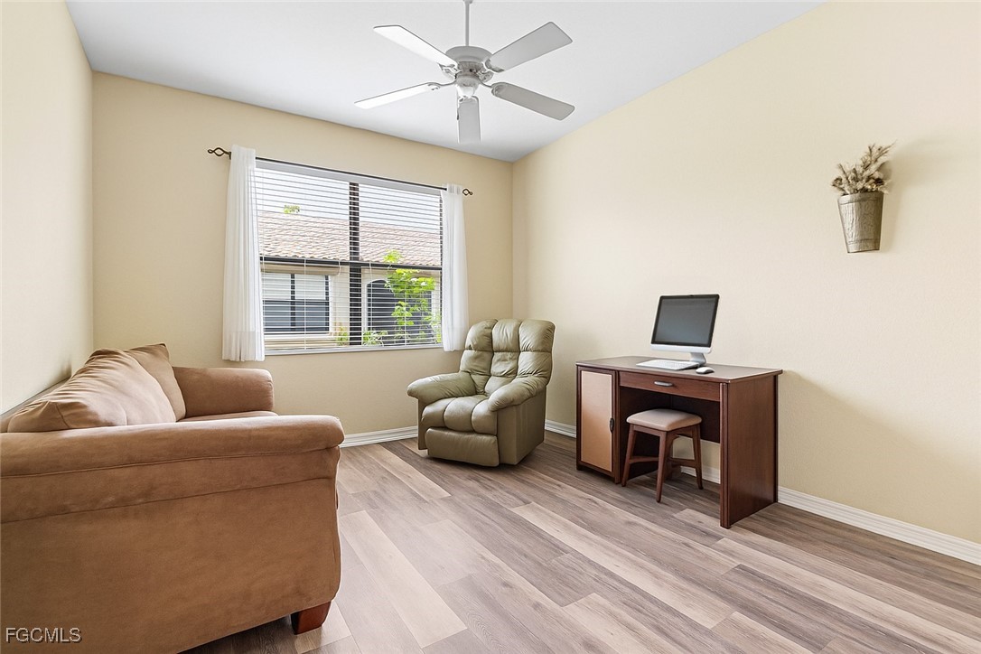 9138 Water Tupelo Road Fort Myers, FL 33912 - Photo 7 of 28 a living room with furniture and a window