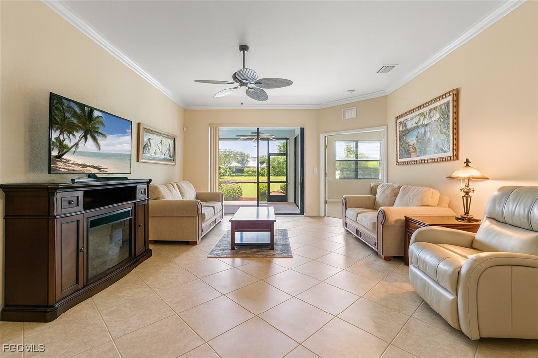 9138 Water Tupelo Road Fort Myers, FL 33912 - Photo 9 of 28 a living room with furniture and a flat screen tv