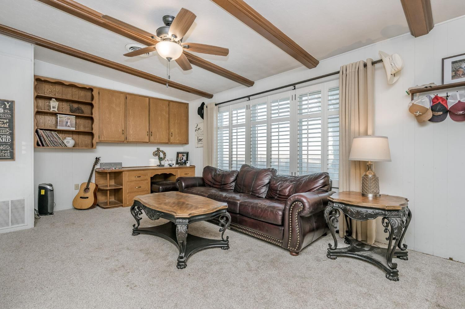 1401 County Road Z Plainview, TX 79072 - Photo 13 of 41 a living room with furniture and a window