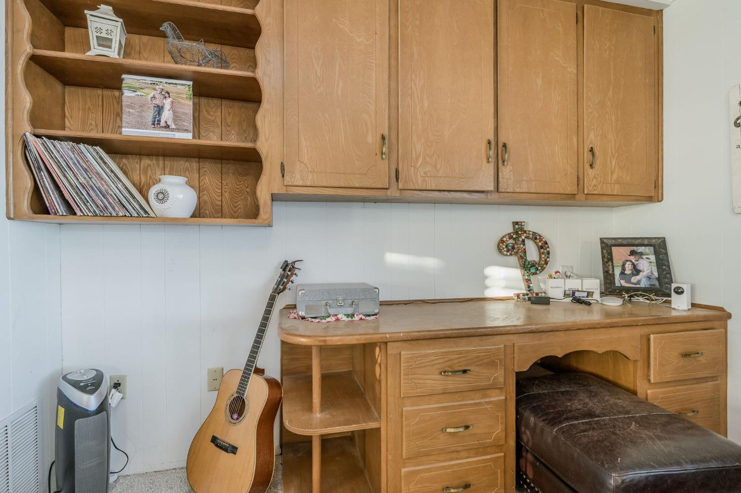 1401 County Road Z Plainview, TX 79072 - Photo 14 of 41 a kitchen with a cabinets and window