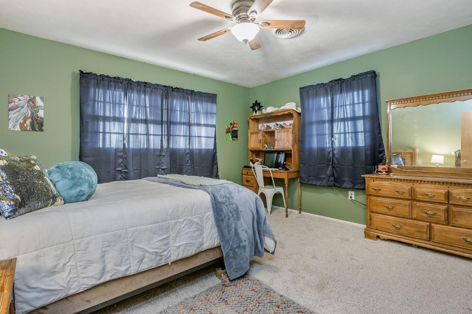 1401 County Road Z Plainview, TX 79072 - Photo 24 of 41 a bedroom with a bed and a dresser