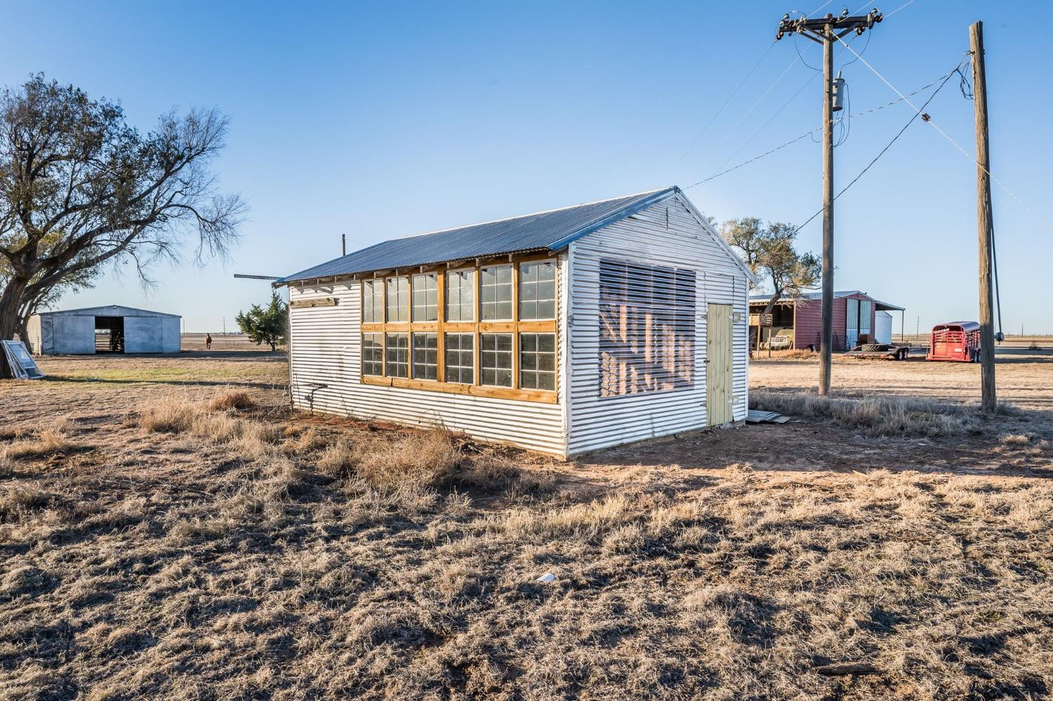 1401 County Road Z Plainview, TX 79072 - Photo 35 of 41 a view of a house with a wooden fence