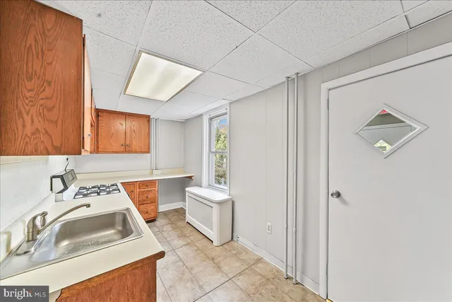 a bathroom with a sink toilet and tub