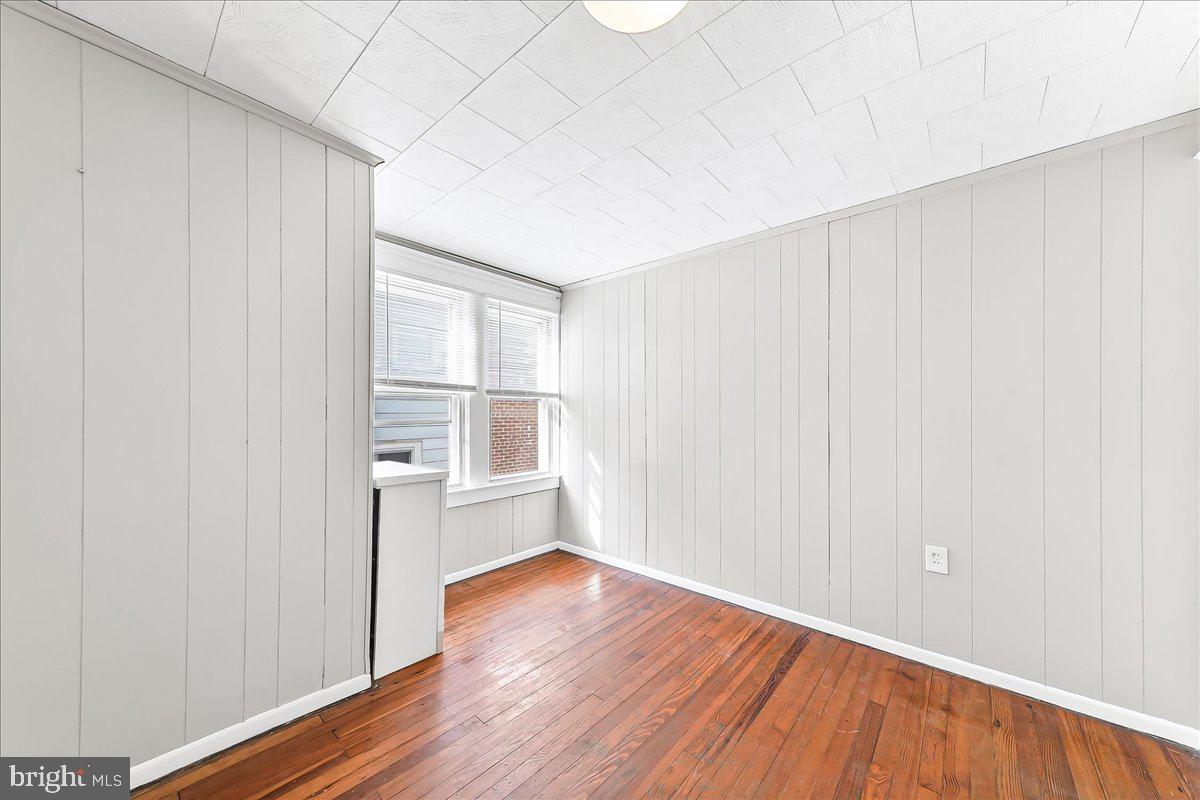 1024 East 18th Street Chester, PA 19013 - Photo 19 of 31 a view of empty room with wooden floor