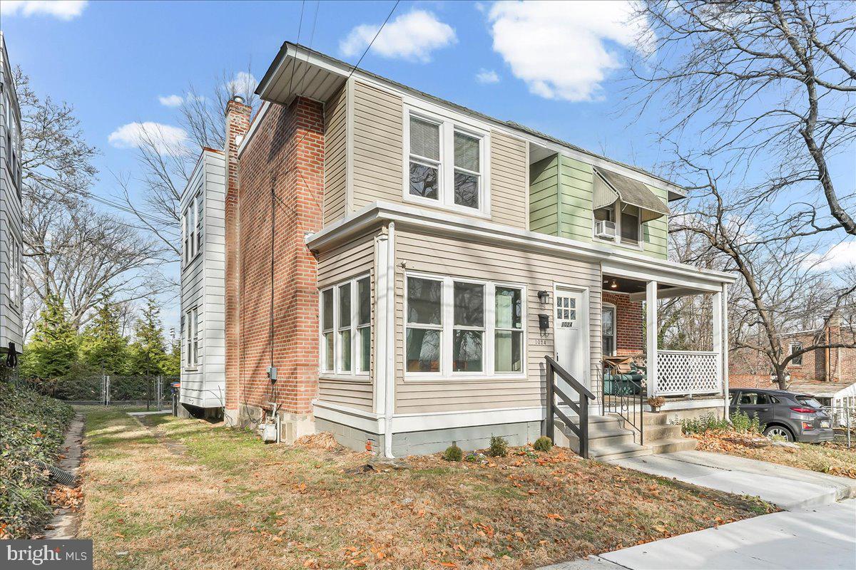 1024 East 18th Street Chester, PA 19013 - Photo 2 of 31 a front view of a house with a yard