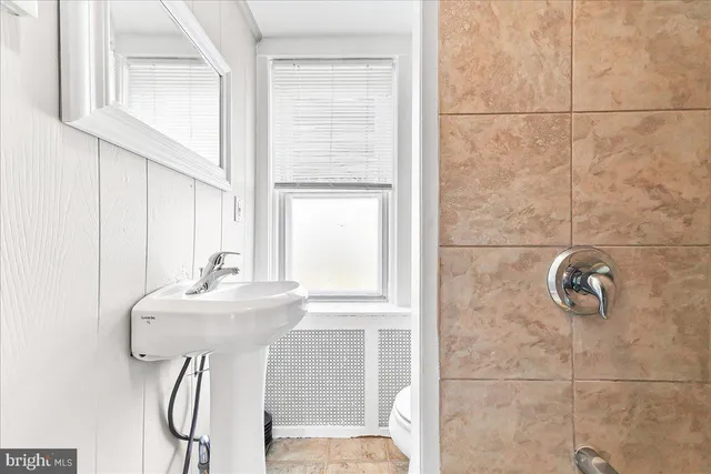 a bathroom with a table and a sink