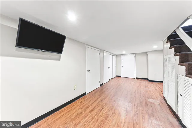 a view of a livingroom with wooden floor
