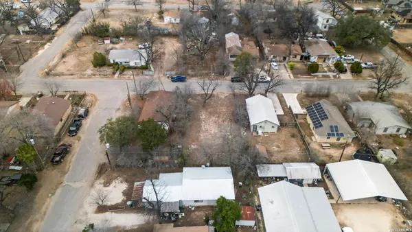 an aerial view of a house with outdoor space