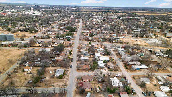 an aerial view of residential houses with outdoor space