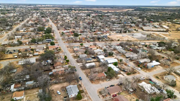 an aerial view of residential building and ocean view