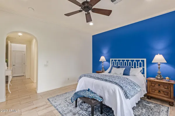 a bed room with a bed and a lamp