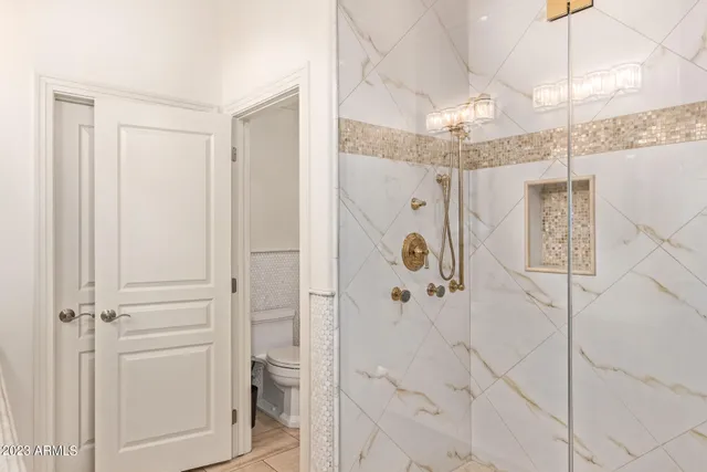 a bathroom with a shower and a sink