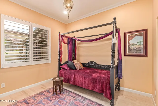 a bed room with a bed and a window