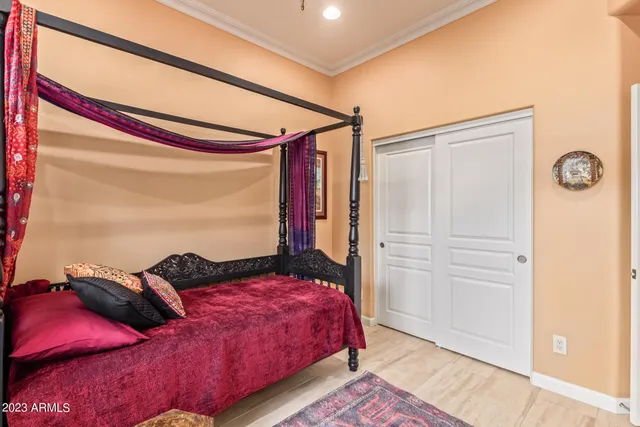 a bedroom with a bed and a closet