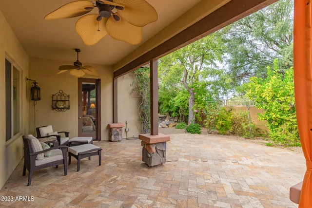 a view of a patio with a backyard