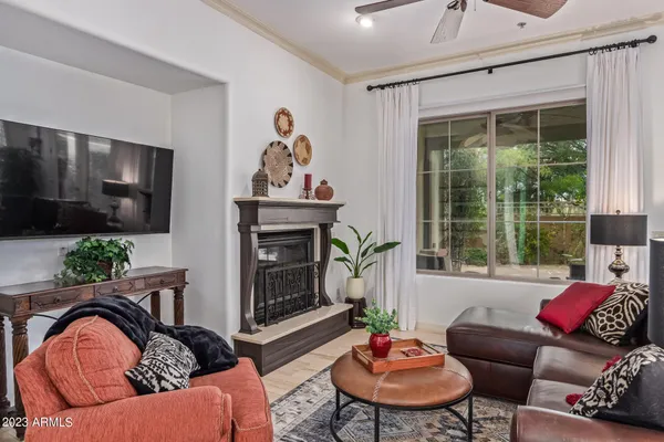 a living room with furniture flowerpot and a window