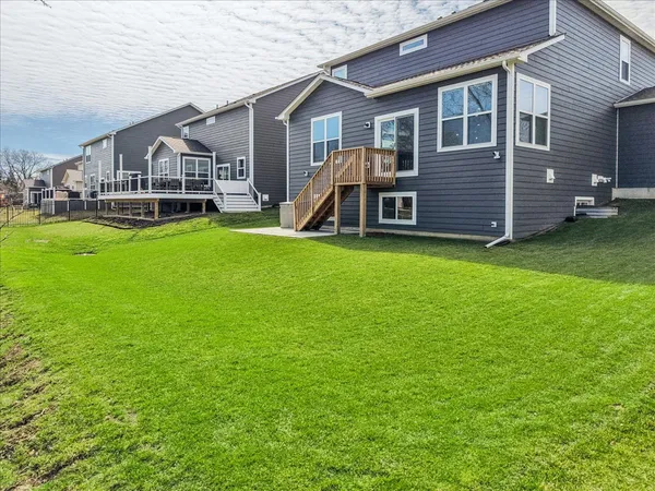 a view of a house with a backyard