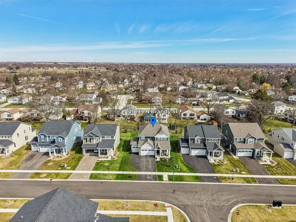 an aerial view of residential houses with outdoor space