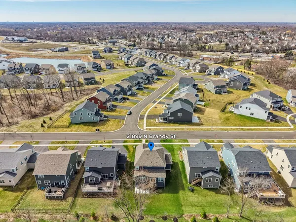 an aerial view of residential houses with outdoor space
