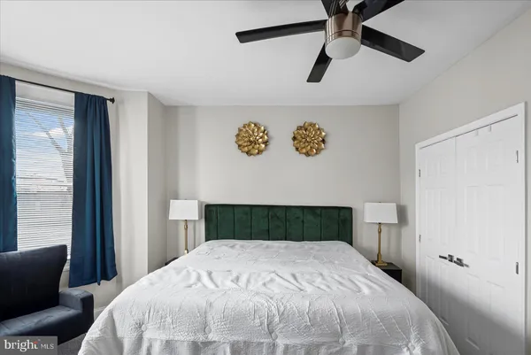 a view of a livingroom with furniture and a window
