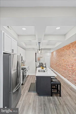 a view of a livingroom with furniture and wooden floor