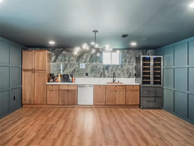a kitchen with cabinets and window