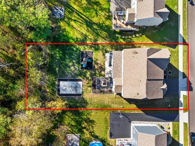 an aerial view of a house with swimming pool