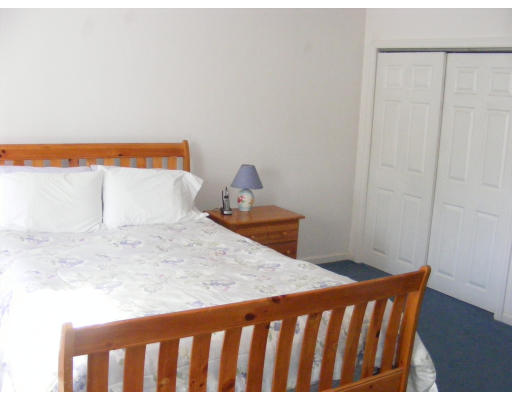 32 Evergreen Road Natick, MA 01760 - Photo 18 of 24 a bedroom with a bed and chair