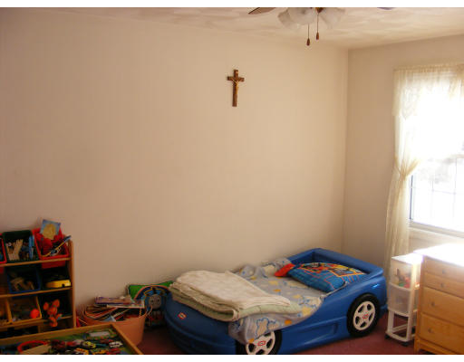 32 Evergreen Road Natick, MA 01760 - Photo 20 of 24 a bedroom with a bed and a window