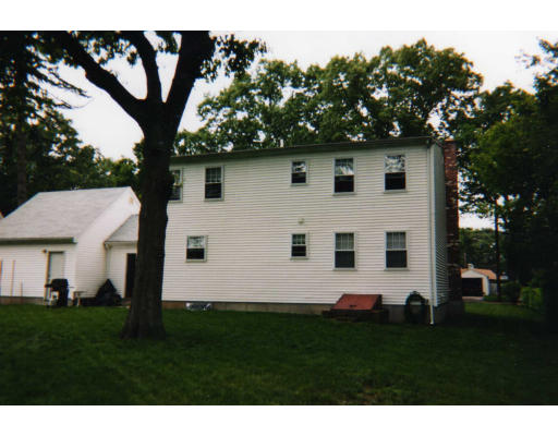 32 Evergreen Road Natick, MA 01760 - Photo 2 of 24 a white house that has a tree in front of a yard