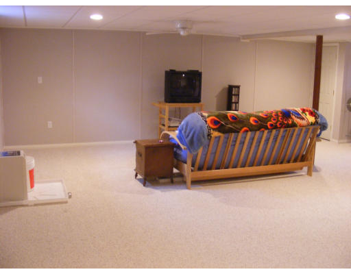 32 Evergreen Road Natick, MA 01760 - Photo 21 of 24 a bedroom with furniture and a flat screen tv