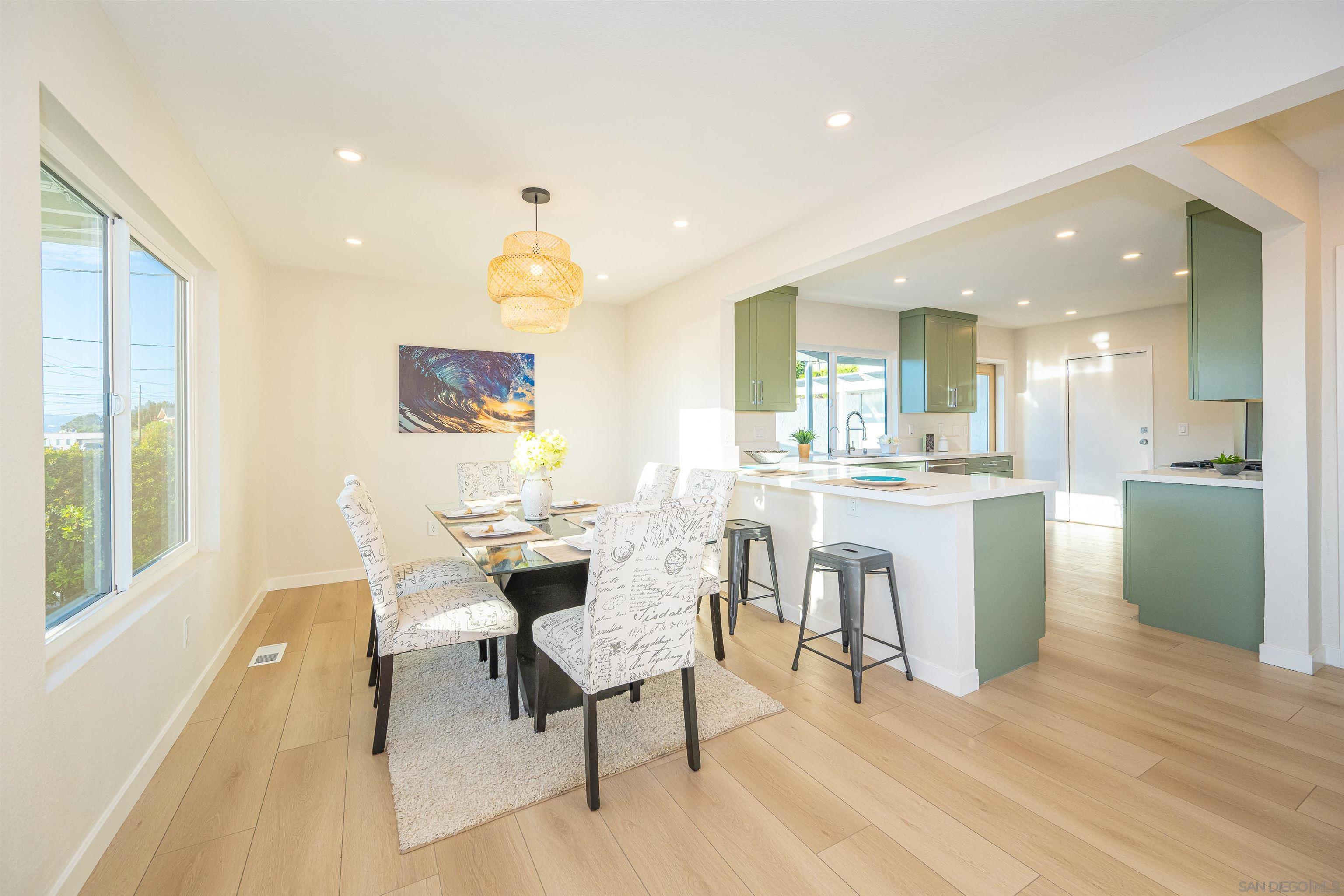 1360 Elevation Road San Diego, CA 92110 - Photo 13 of 37 a living room with kitchen island furniture and a kitchen view