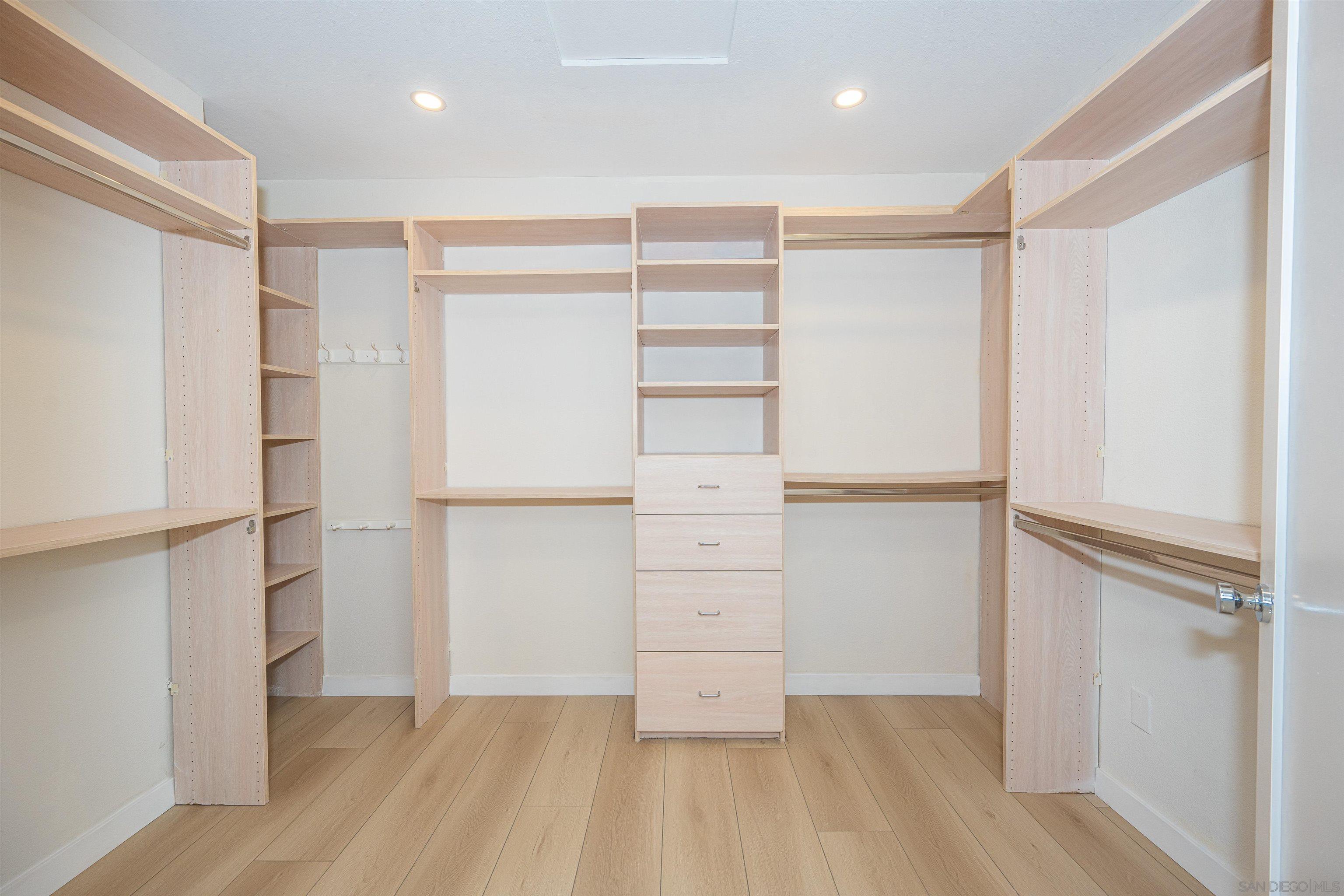 1360 Elevation Road San Diego, CA 92110 - Photo 23 of 37 a view of walk in closet with wooden floor