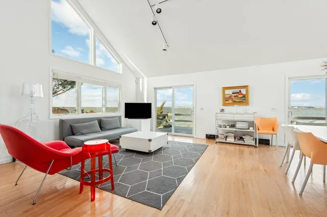 a living room with furniture or couch and a flat screen tv