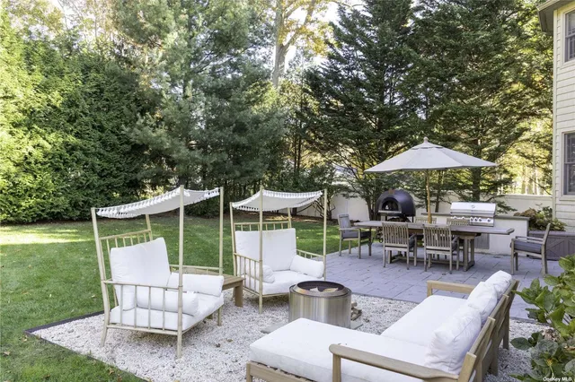 a view of backyard with seating space and garden