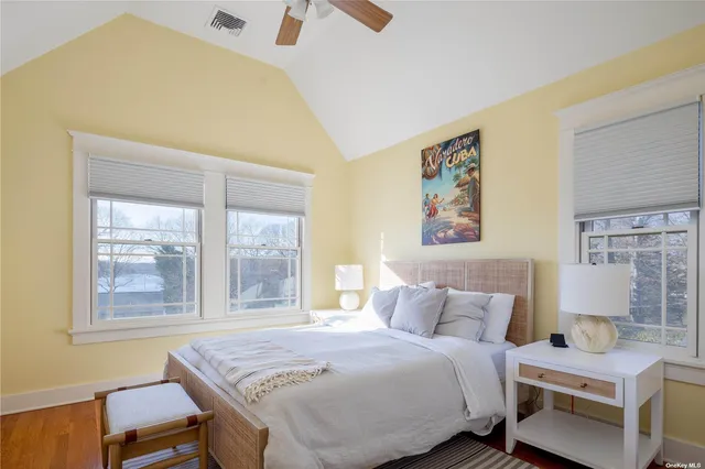 a bedroom with a bed and a table