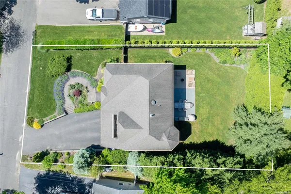 an aerial view of a house with a garden
