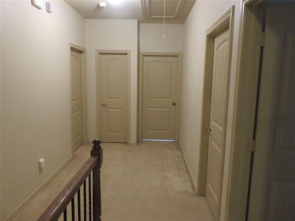 1122 Walter Stephenson Road Midlothian, TX 76065 - Photo 25 of 26 Hallway featuring neutral wall tones and beige carpeted flooring