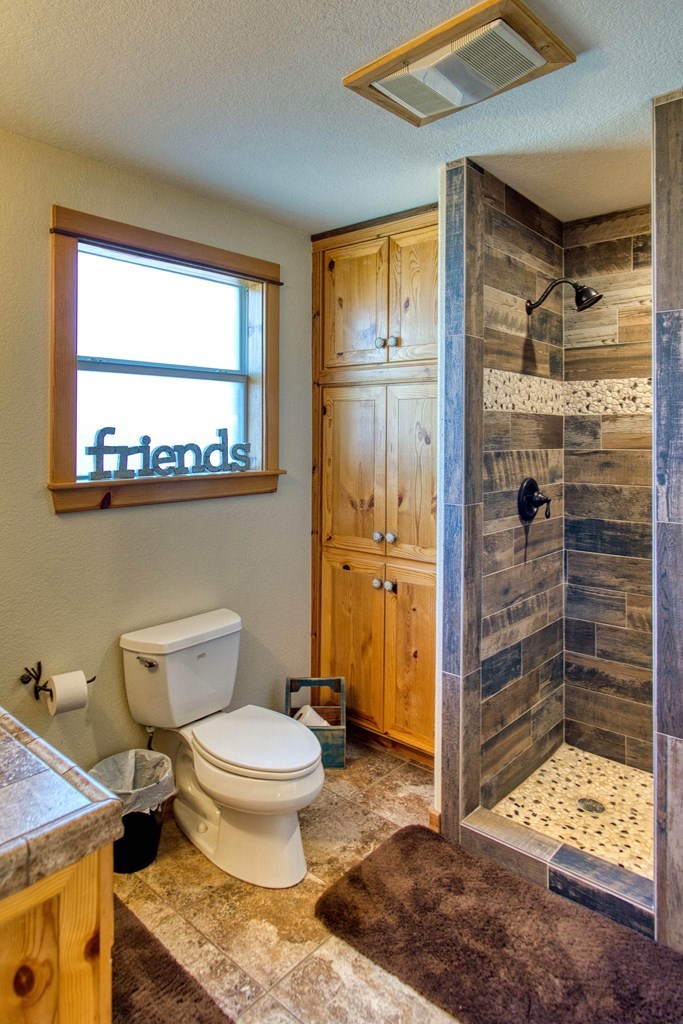 6446 Blackjack Road Fredonia, TX 76842 - Photo 26 of 48 a bathroom with a toilet shower and a sink