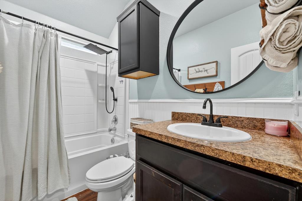 833 Rutherford Drive Crowley, TX 76036 - Photo 16 of 30 Bathroom with updated mirror and Cabinet