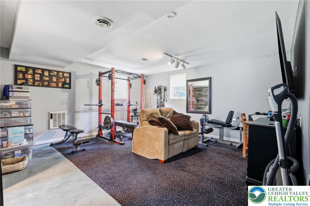 732 Bushkill Center Road Nazareth, PA 18064 - Photo 21 of 43 Fitness retreat, featuring exercise equipment and a comfortable seating area, provides a versatile space for recreation.