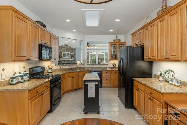 a bedroom with a bed dresser and wooden floor
