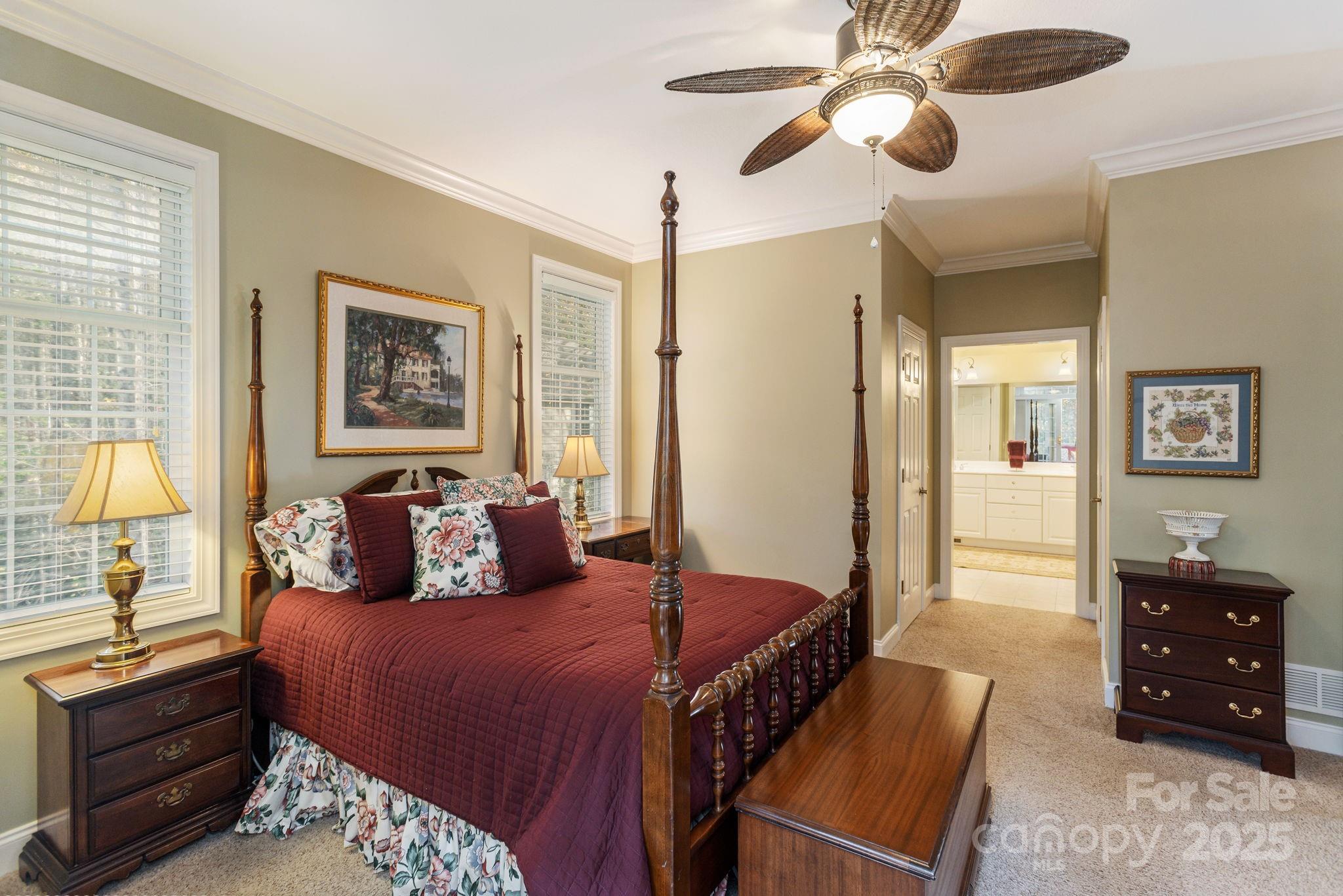 115 Chancery Court Flat Rock, NC 28731 - Photo 24 of 47 a bedroom with a bed dresser and wooden floor