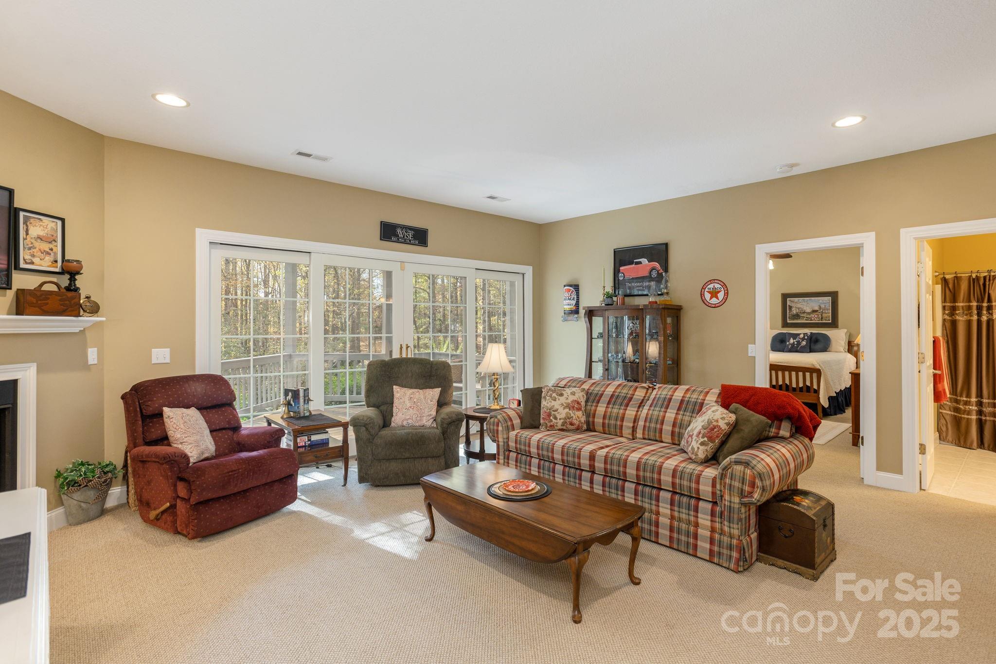 115 Chancery Court Flat Rock, NC 28731 - Photo 32 of 47 a living room with furniture and a large window