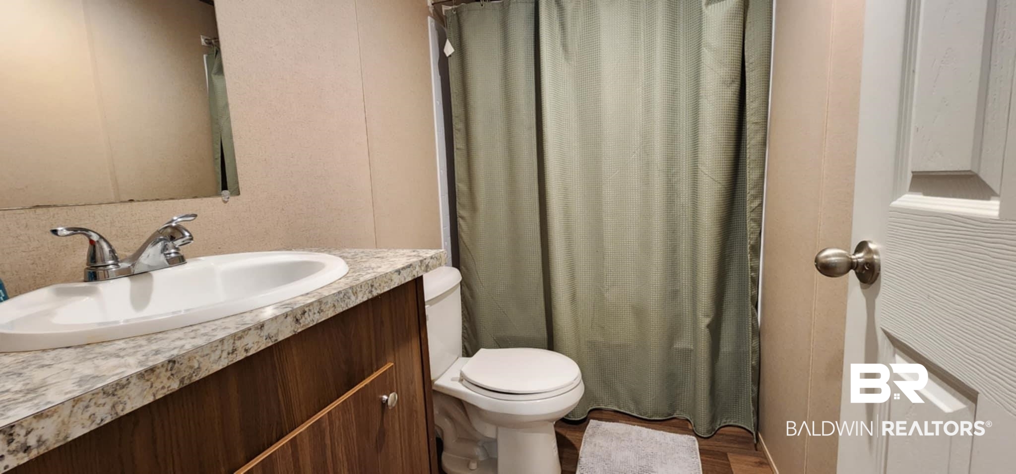 25474 Waterworld Road Robertsdale, AL 36567 - Photo 27 of 30 Full bathroom featuring vanity, wood finished floors, and curtained shower