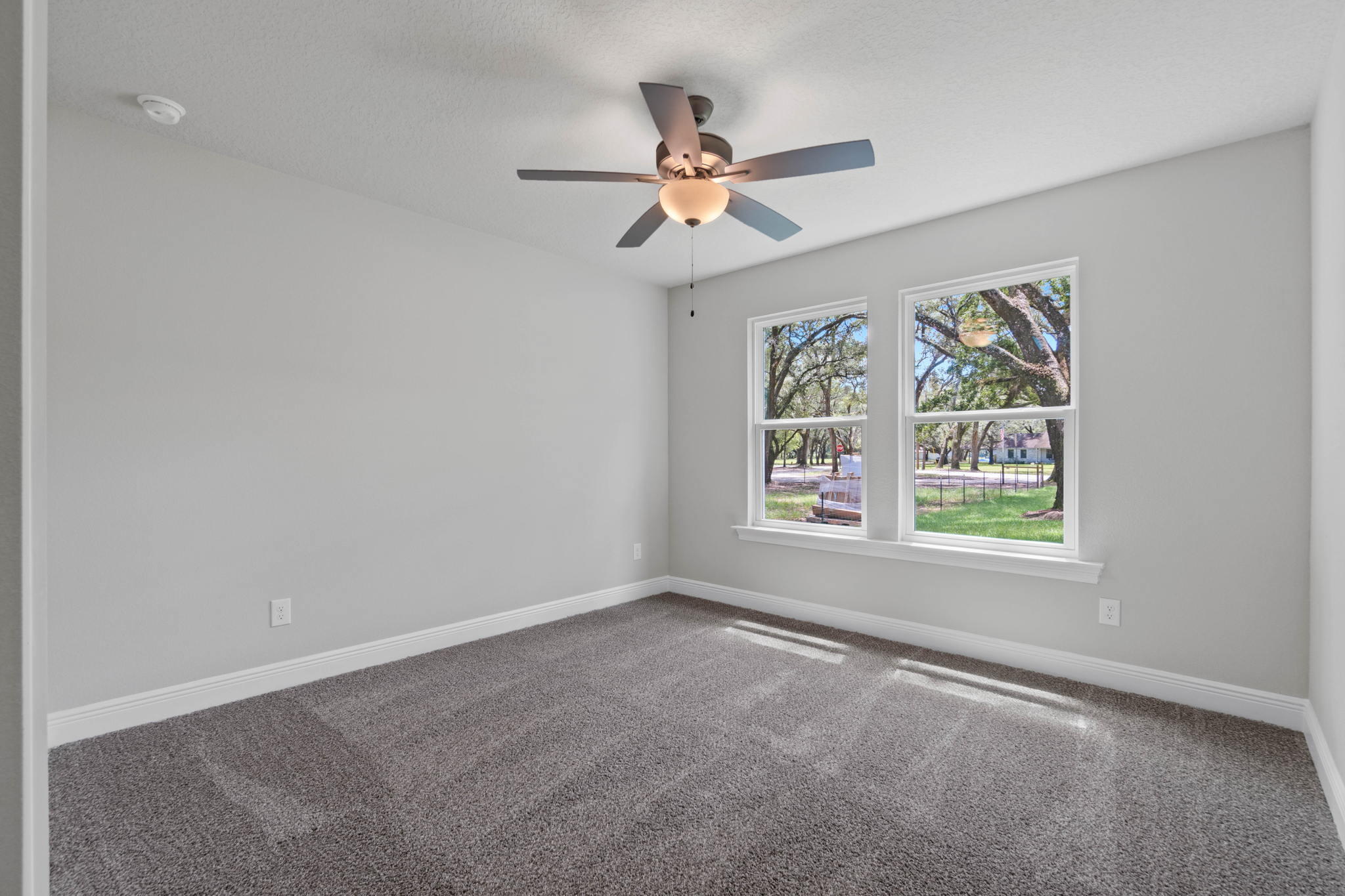 9194 Trident Road Milton, FL 32583 - Photo 33 of 45 an empty room with windows and fan