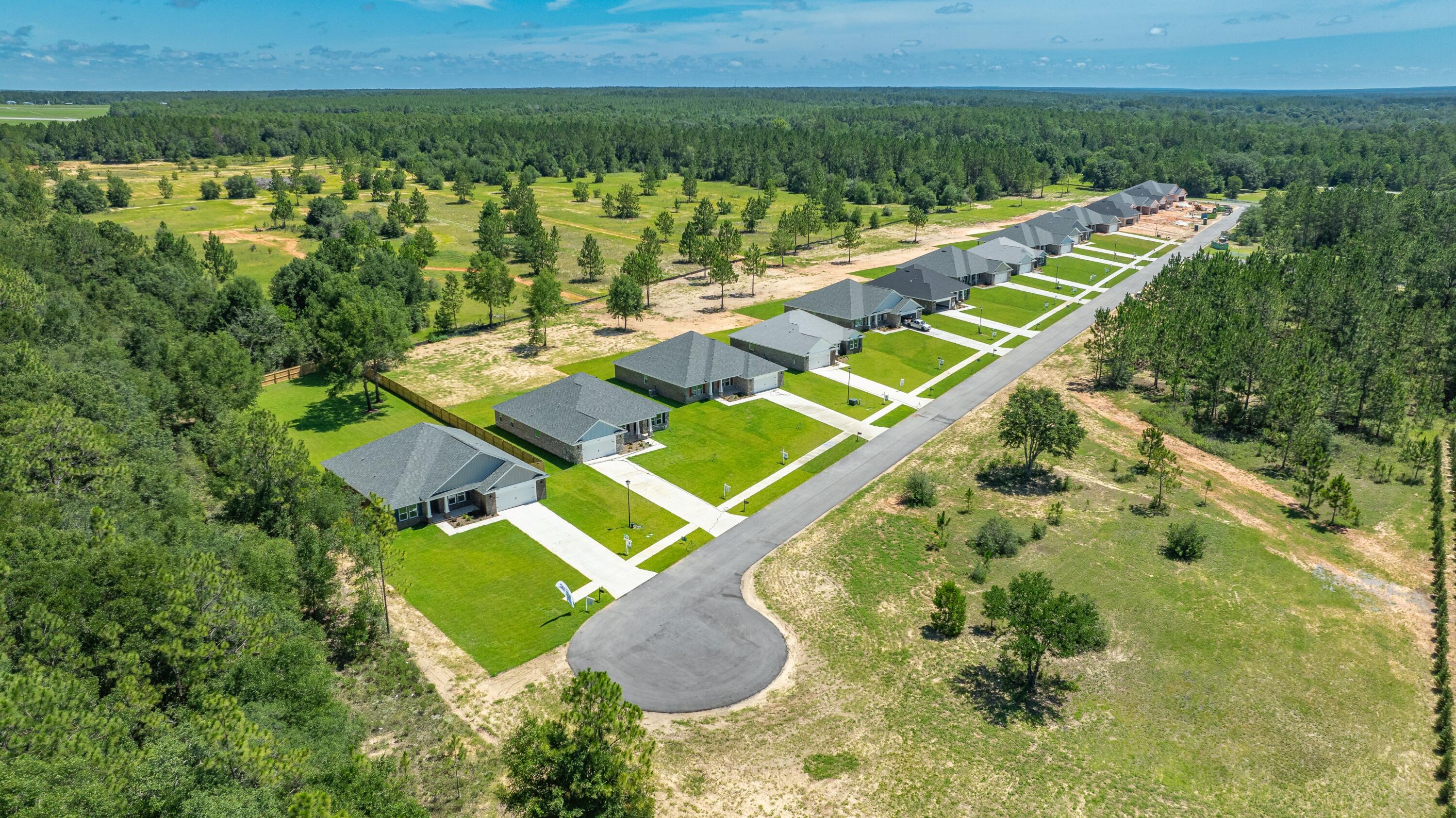 9194 Trident Road Milton, FL 32583 - Photo 42 of 45 an aerial view of a house with a yard
