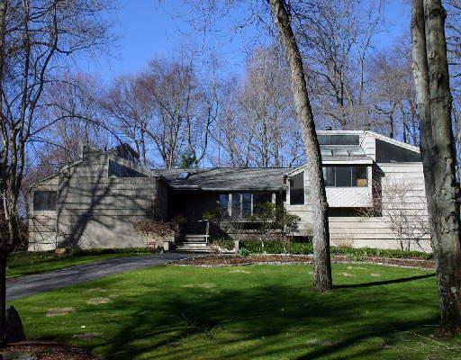 69 High Point Road Westport, CT 06880 - Photo 1 of 1 a front view of a house with a yard