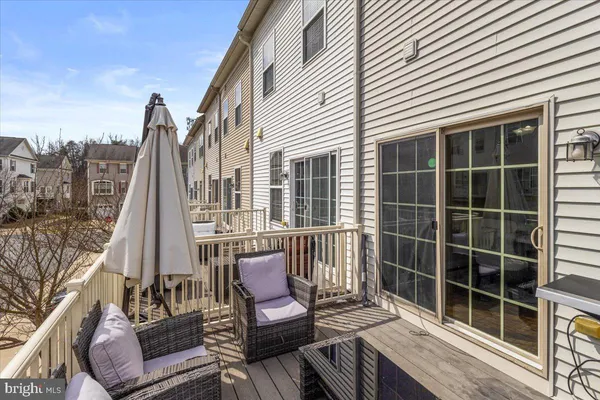 a view of a patio with a table and chairs